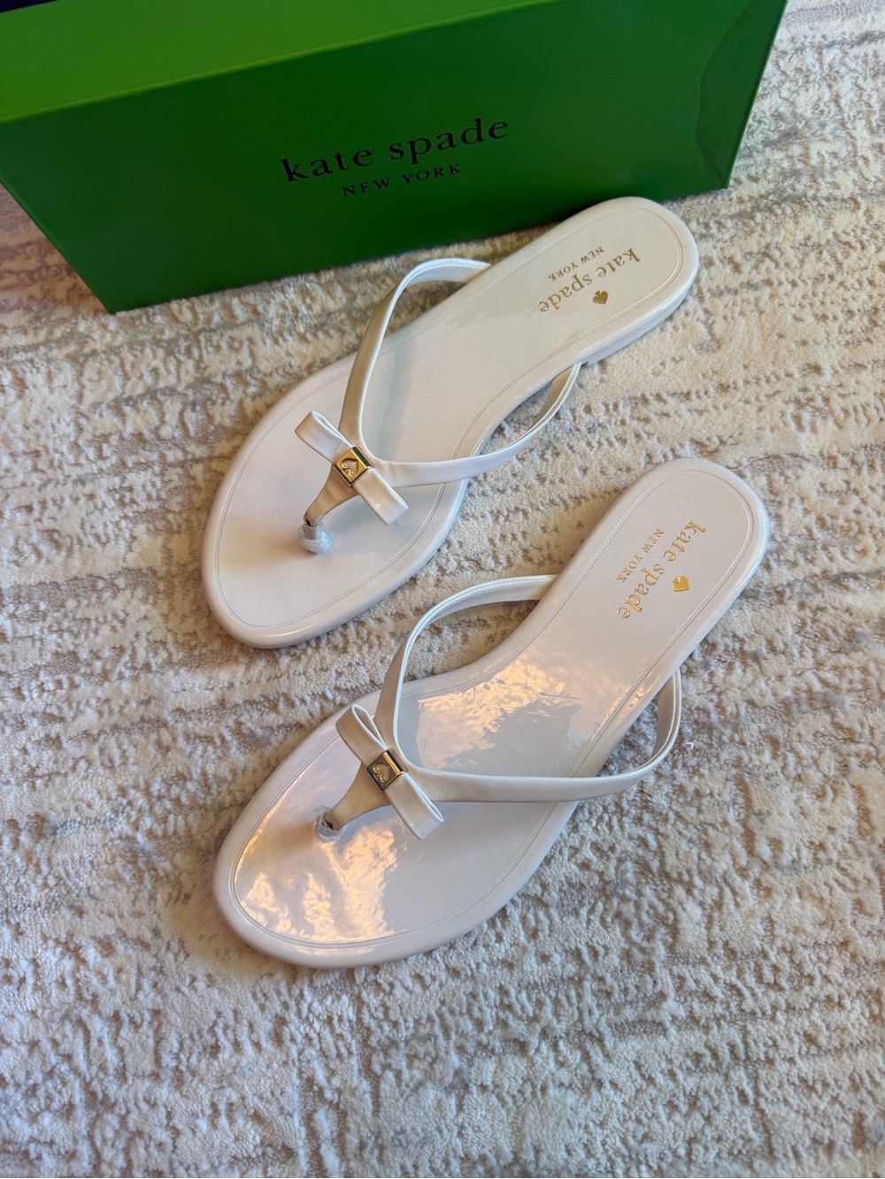 kate spade White Patent Bow Thong Sandals with Gold Accent
